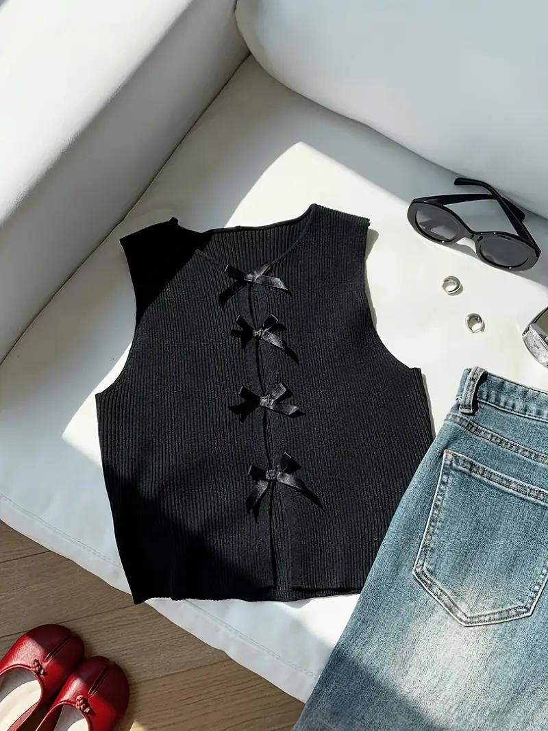 ed46fd96-f83f-4002-8ddd-0290a81ee0a7.webp Blusa con detalle de botones de lazos - Imagen 1
